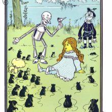 A girl is sitting on a riverbank surrounded by field mice as she is introduced to their queen