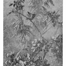 A small bird is about to take flight from the branch of a flowering wild rose shrub