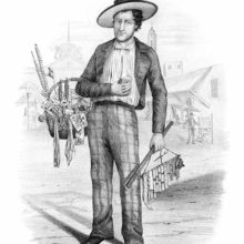 A dry-goods dealer stands in the middle of a street with a basket full of notions items on his arm