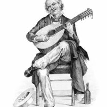 A smiling middle-aged man sits on a chair playing the twelve-string mandolin