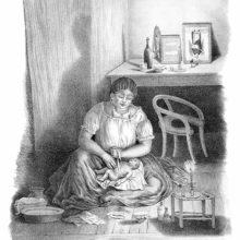 A woman sits on the floor, wrapping up a baby lying in her lap as a candle burns in the foreground