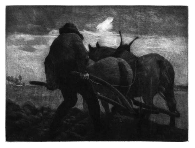 A man is seen from the back plowing a field behind two horses under a cloudy sky