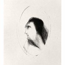 The face of a man is seen from the side framed in an oval medallion.