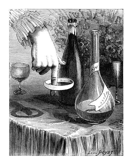 A woman's hand is seen with a napkin ring made to spin around the tip of the forefinger