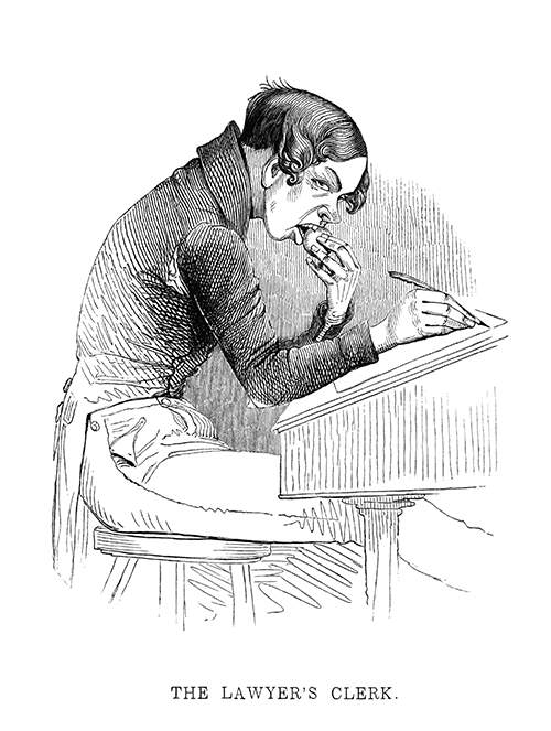 A young man in a torn jacket sits at a desk and eats an apple while writing on a piece of paper.