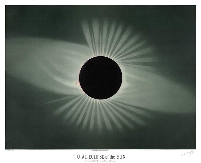 Solar eclipse showing the Moon covering the entire Sun's disk, with light radiating from behind