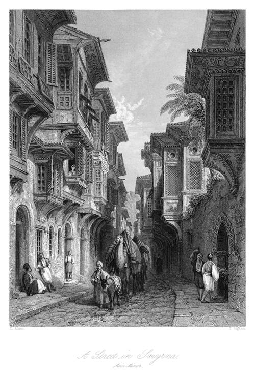 Street in Izmir showing balconies projecting over the sidewalks and a merchant leading camels