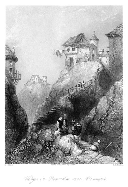 View of groups of houses standing at the top of rocky peaks made accessible by steep stairways