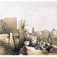 A group of men smoking chibouks is sitting by the walls of the Jerusalem Citadel