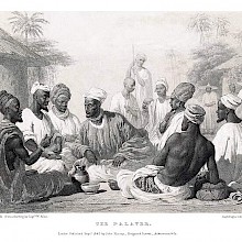 A group of men is sitting in a circle, having a discussion while onlookers stand at some distance
